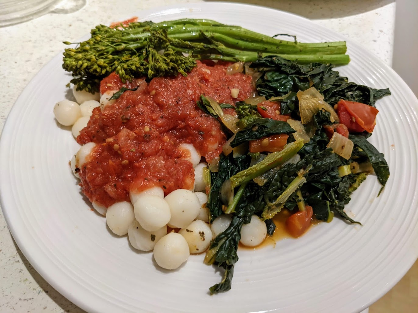 Baby gnocchi, with roasted pasta sauce, broccolini and kale greens.