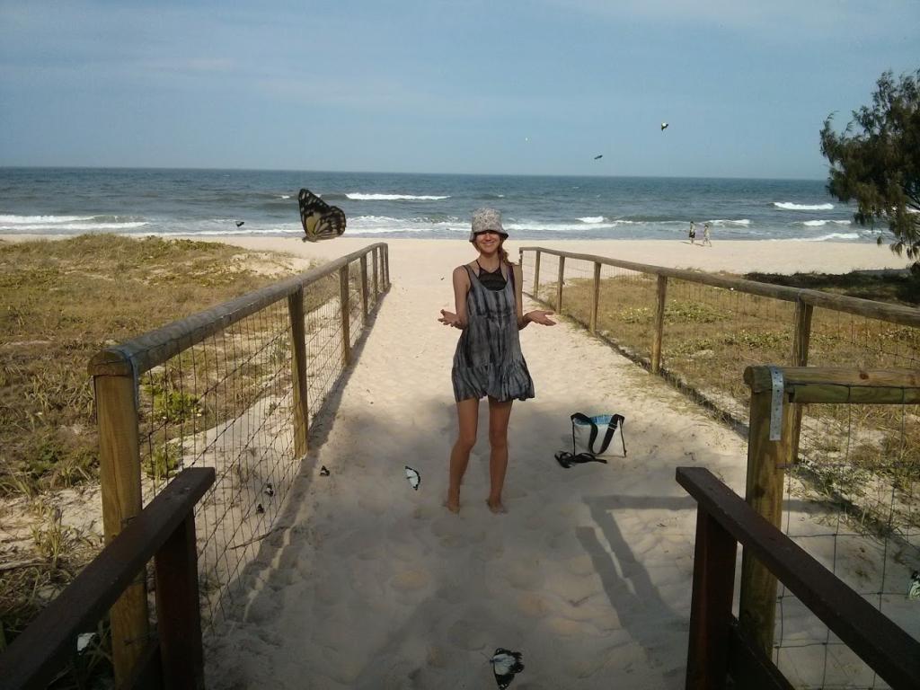 Cathy and butterflies on beach